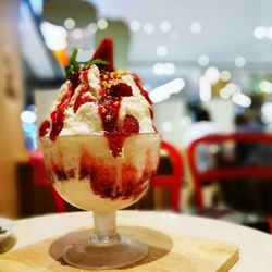 Close-up of ice cream served on table