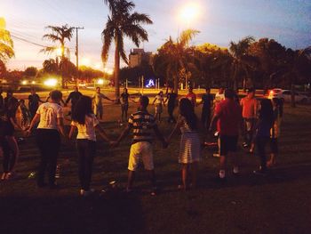 People sitting in park during sunset