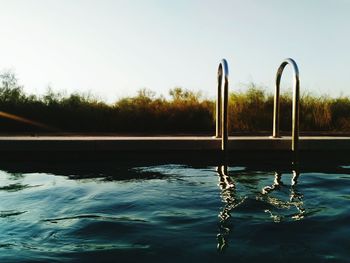 Close-up of swimming pool against clear sky
