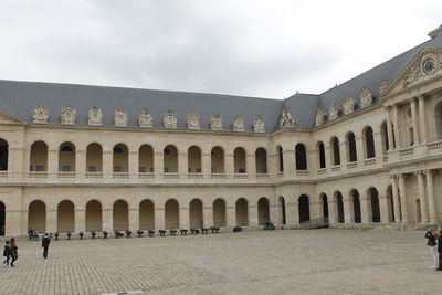 Facade of historic building against sky