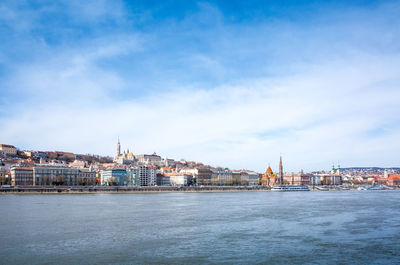 View of river with buildings in background