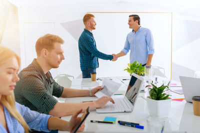 Business colleagues working at office
