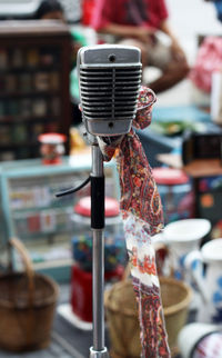 Close-up of scarf tied on microphone at market