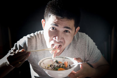 Portrait of man eating food