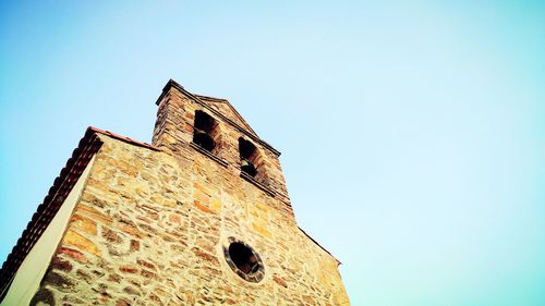 Low angle view of castle against blue sky