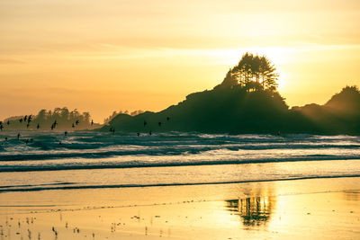 Scenic view of silhouette land against sky during sunset