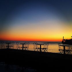 Scenic view of sea against clear sky during sunset
