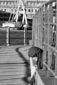 Woman standing by railing