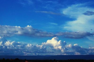 Scenic view of landscape against blue sky