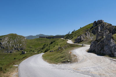 Scenic view of mountains against clear blue sky