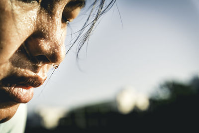 Close-up portrait of man against sky