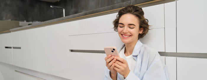 Young woman using mobile phone