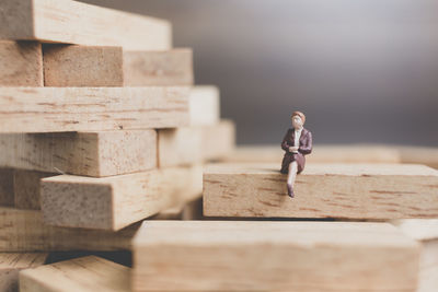 Close-up of boy playing on wood