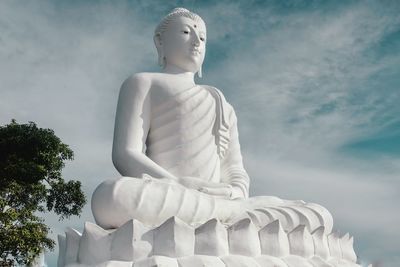 Low angle view of statue against sky