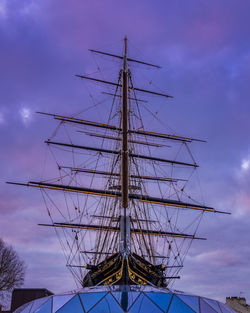 Low angle view of sailboat against sky at dusk