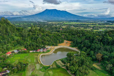 High angle view of townscape and mountains against sky