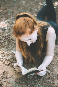 Young woman sitting outdoors