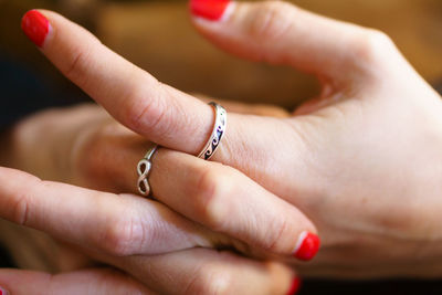 Close-up of couple holding hands