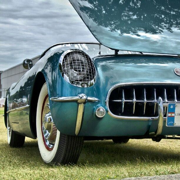 transportation, mode of transport, land vehicle, car, travel, sky, vehicle interior, stationary, side-view mirror, vintage car, part of, cloud - sky, glass - material, public transportation, headlight, reflection, day, vehicle part, vehicle, field