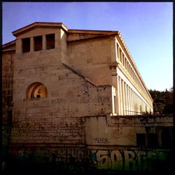 Low angle view of built structure against clear blue sky