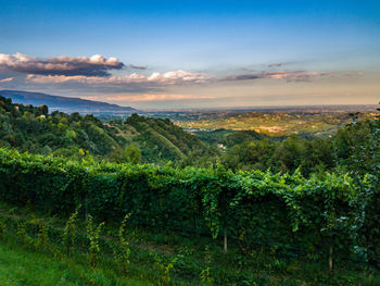 Scenic view of mountains against cloudy sky
