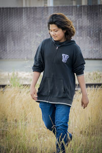 Full length of woman standing on field