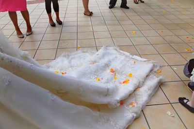 Low section of people standing on footpath