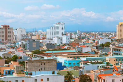 High angle view of buildings in city against sky