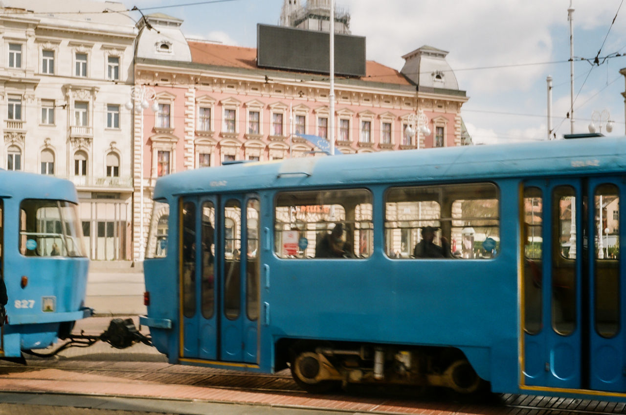 TRAIN ON RAILROAD TRACKS IN CITY