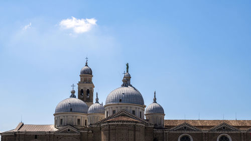 Low angle view of building against blue sky