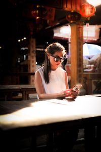 Young woman looking at phone