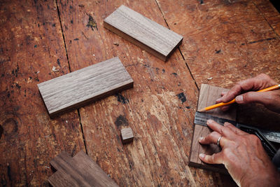 Close-up of man working on wood