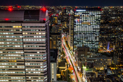 Illuminated buildings in city at night