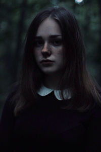 Portrait of young woman in forest