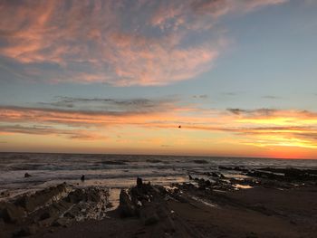 Scenic view of sea against dramatic sky