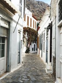 Narrow street amidst buildings in town