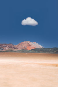Scenic view of arid landscape against sky