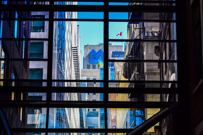 Reflection of buildings on glass window