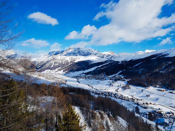 Scenic view of snowcapped mountains against sky