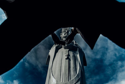 Low angle view of statue against sky