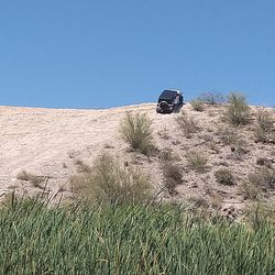 Vintage car on land against clear sky