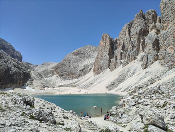 Scenic view of snowcapped mountains against clear blue sky
