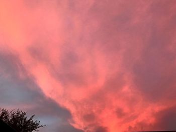 Low angle view of dramatic sky during sunset