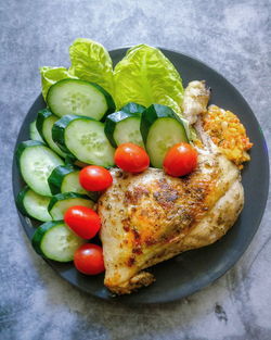 High angle view of vegetables in plate on table