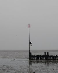 Pier on sea against sky