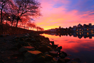 Scenic view of lake at sunset