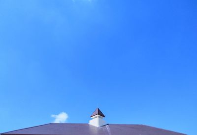 Low angle view of building against clear blue sky