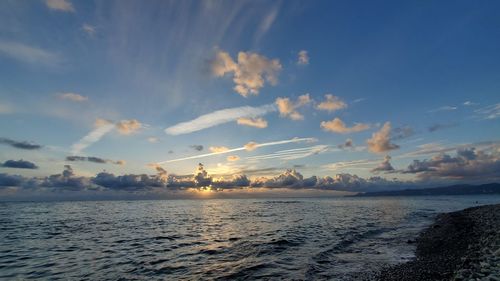 Scenic view of sea against sky at sunset