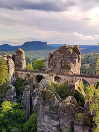 View of rock formations and a man-made bridge in it.