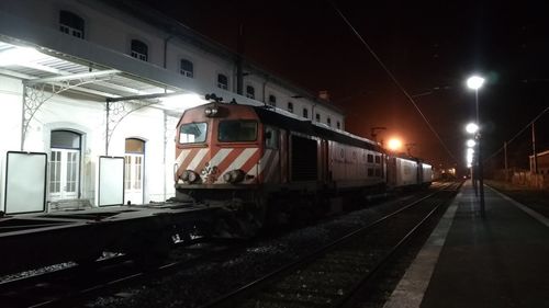 Train at railroad station at night